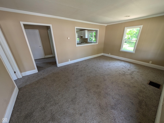 603 W 33rd St, Anderson, IN 46013 - empty room with crown molding and carpet flooring