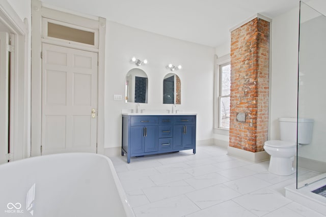 bathroom featuring vanity, a tub, and toilet