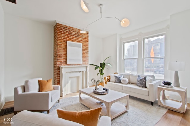 living room featuring a fireplace and light hardwood / wood-style floors