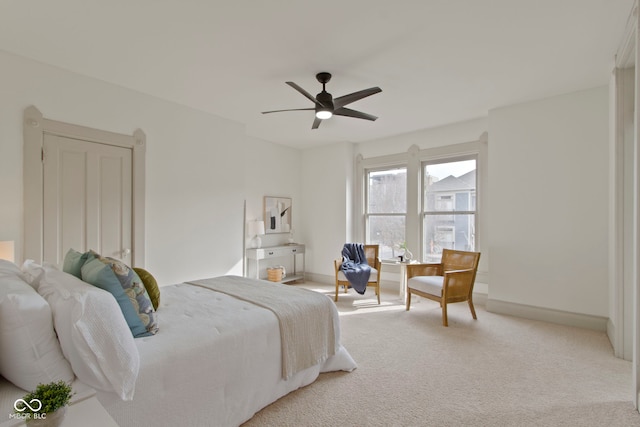 bedroom featuring light carpet and ceiling fan