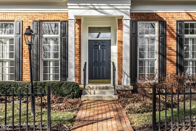 entrance to property with brick siding