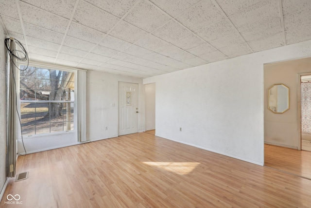 unfurnished room with light wood-type flooring