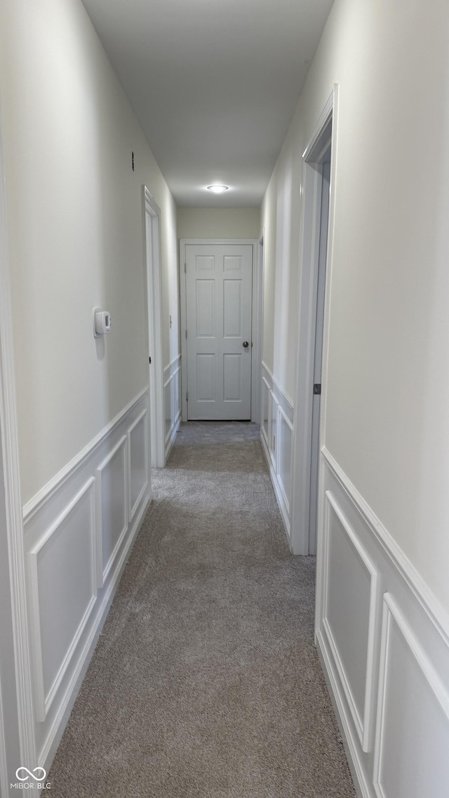 corridor with light carpet