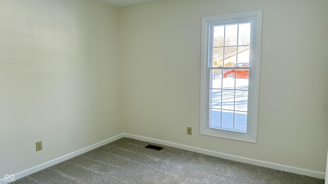 empty room with carpet flooring