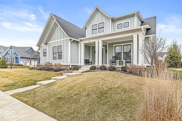 view of front of home featuring covered porch and a front lawn