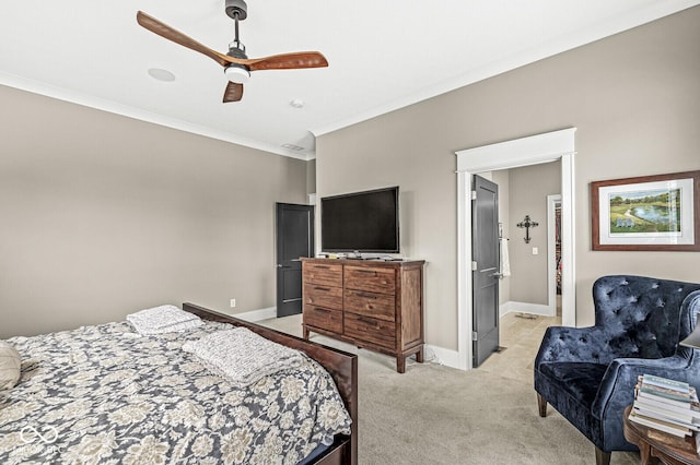 carpeted bedroom featuring ceiling fan and ornamental molding