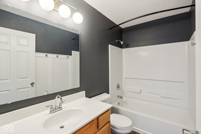 full bathroom featuring vanity, toilet, and shower / washtub combination