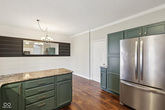 kitchen with dark wood finished floors, ornamental molding, green cabinetry, and stainless steel appliances