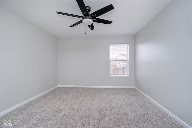 unfurnished room with ceiling fan and carpet flooring