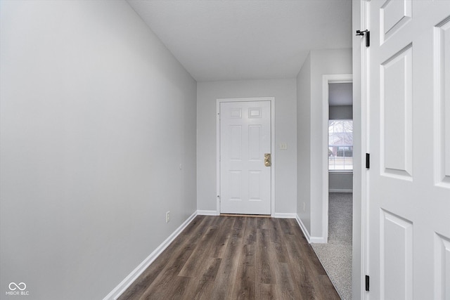 corridor featuring dark hardwood / wood-style flooring