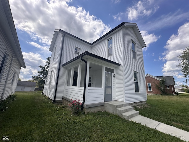 view of front of home featuring a front lawn