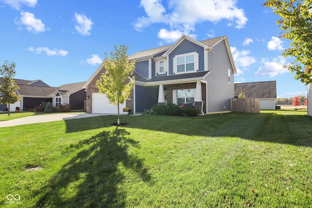 view of front of property featuring a garage, covered porch, and a front lawn