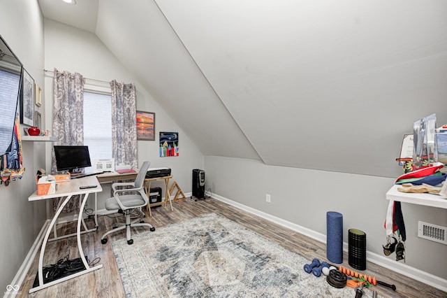 office area featuring wood-type flooring and lofted ceiling