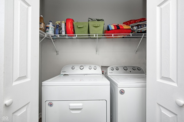 clothes washing area featuring washer and dryer