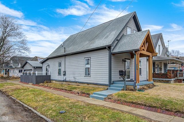 view of front of house with a front lawn and a porch