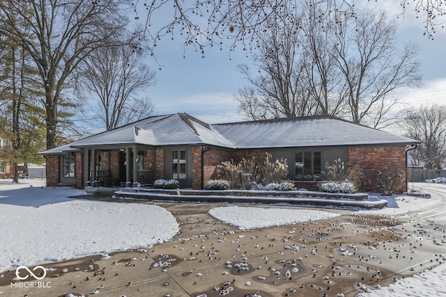 view of snow covered house