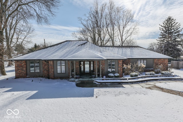 view of snow covered property