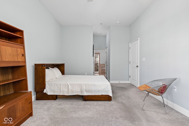 bedroom featuring light carpet