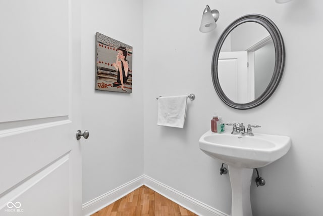 bathroom featuring sink and hardwood / wood-style floors