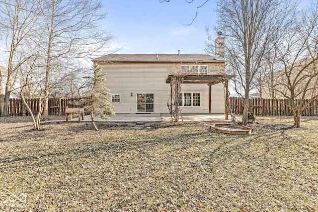 back of property featuring a yard and a patio area