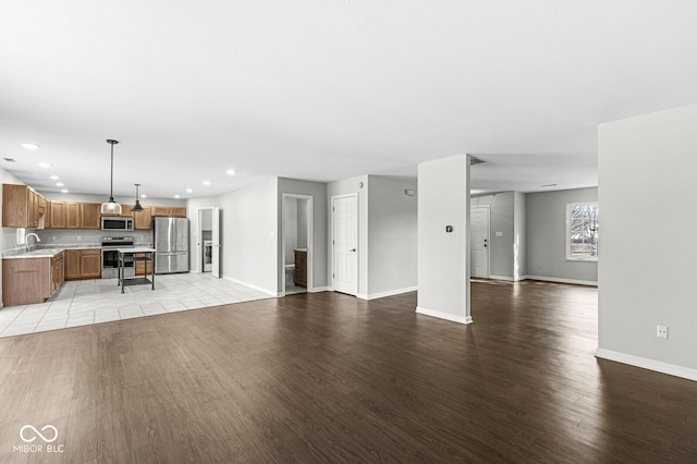 unfurnished living room with light hardwood / wood-style flooring