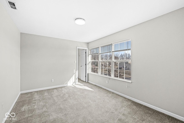 unfurnished room with light colored carpet