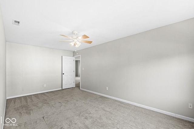 empty room with light carpet and ceiling fan