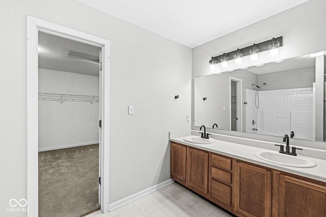 bathroom with vanity and tile patterned flooring