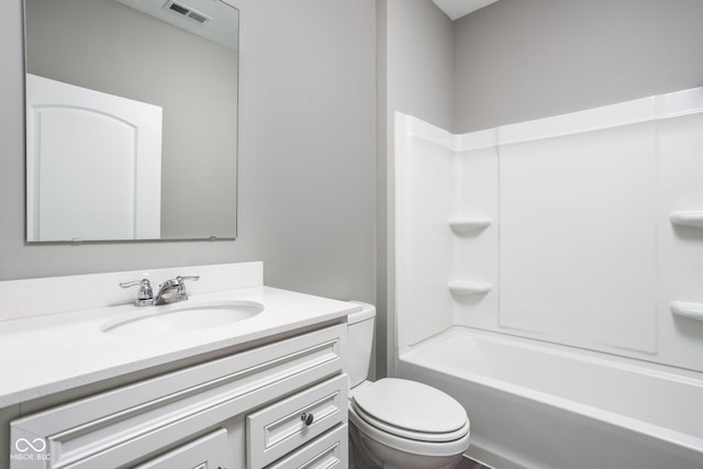 full bathroom with vanity, shower / bathtub combination, and toilet