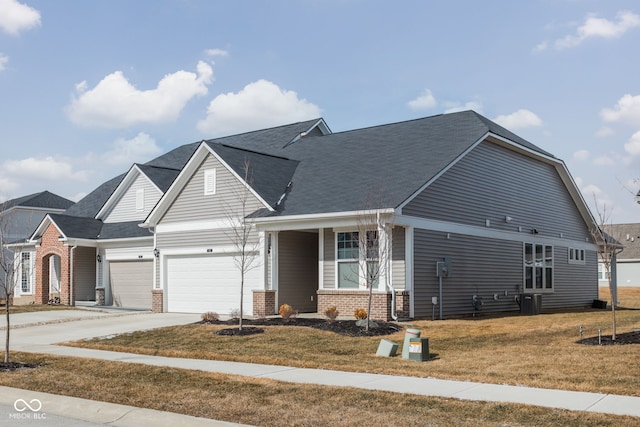 view of front of home featuring a garage, a front yard, and cooling unit