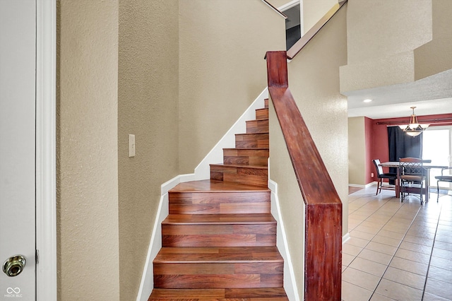 stairway with tile patterned floors