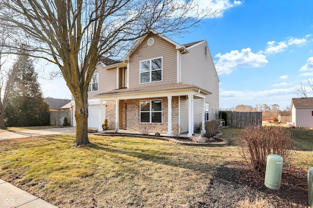 view of front property with a porch, a garage, and a front lawn