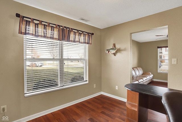 office area with dark hardwood / wood-style floors and ceiling fan