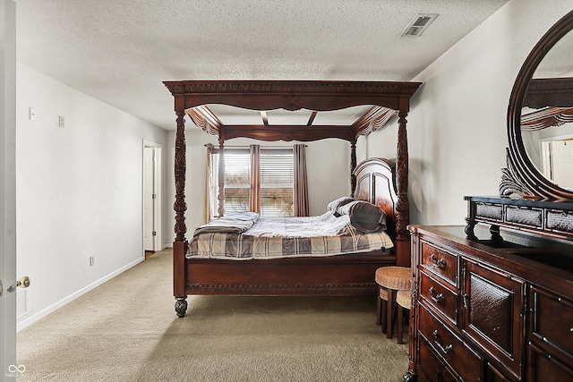 carpeted bedroom featuring a textured ceiling