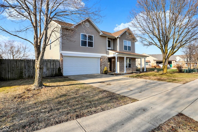 view of front facade with a garage, covered porch, and a front yard