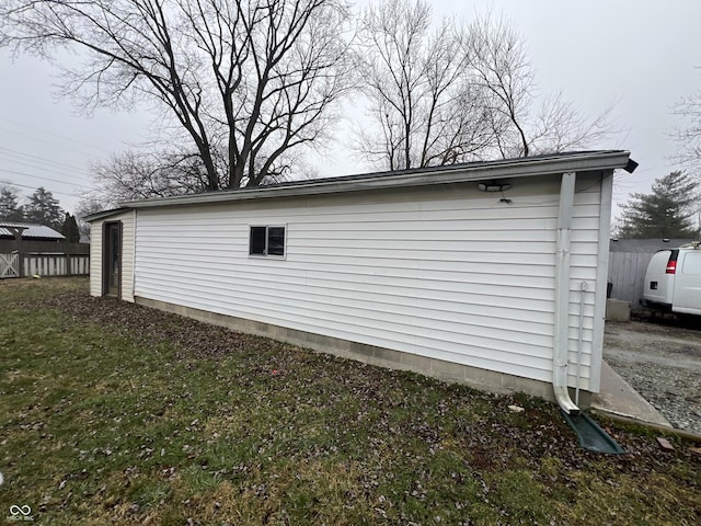 view of property exterior with a lawn