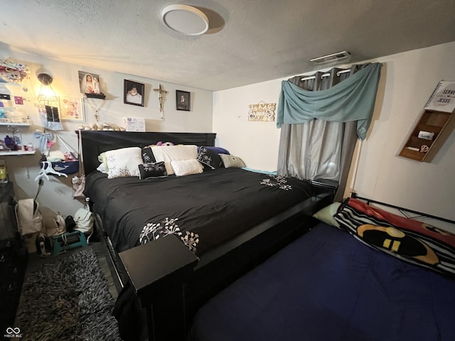 bedroom featuring a textured ceiling