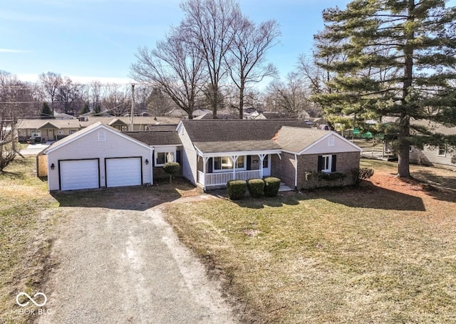 view of front facade featuring dirt driveway, a porch, a front yard, and an attached garage