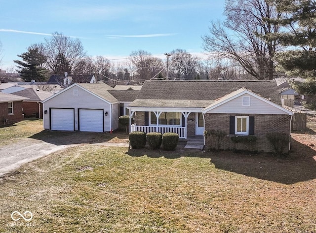 ranch-style house featuring a porch and a front yard