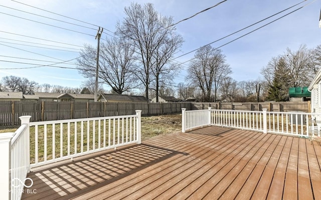 wooden terrace featuring a fenced backyard