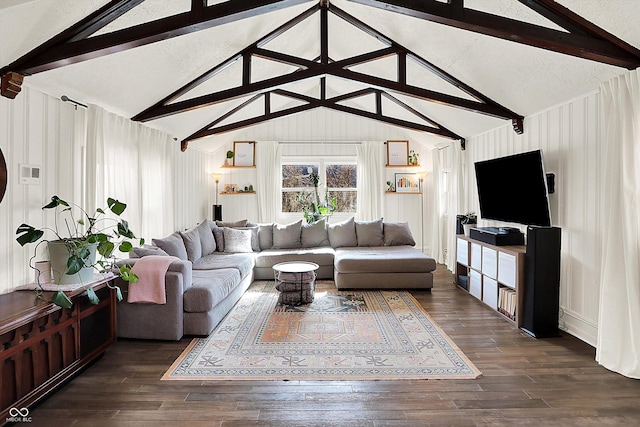 living room with dark hardwood / wood-style flooring and vaulted ceiling with beams