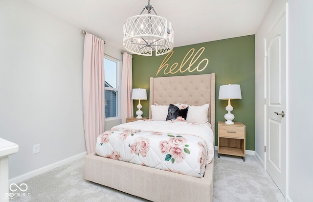 bedroom featuring an inviting chandelier and carpet floors