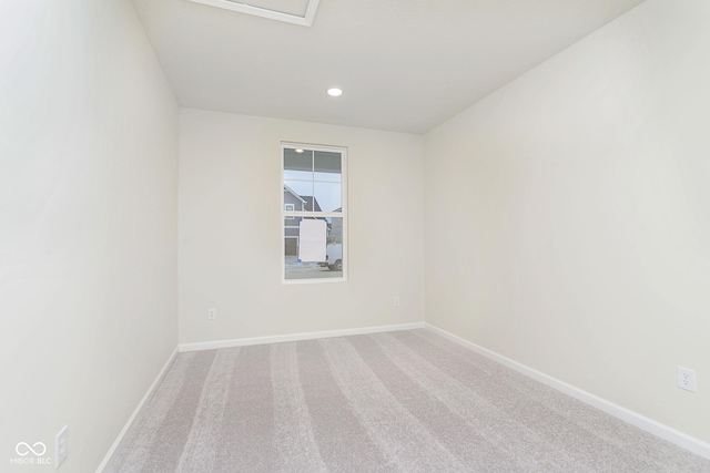 spare room featuring baseboards, carpet flooring, and recessed lighting