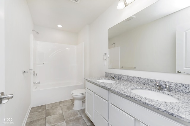 full bath with  shower combination, double vanity, a sink, and toilet