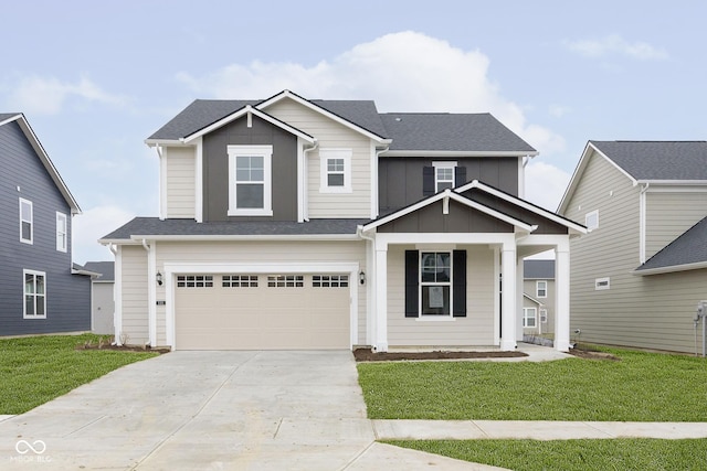 view of front of house featuring a shingled roof, an attached garage, board and batten siding, a front yard, and driveway