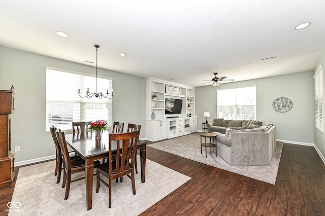 dining area featuring ceiling fan with notable chandelier, baseboards, dark wood-type flooring, and recessed lighting