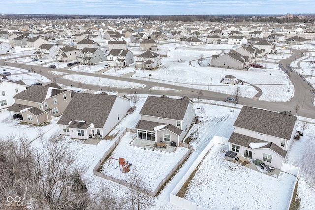 snowy aerial view featuring a residential view