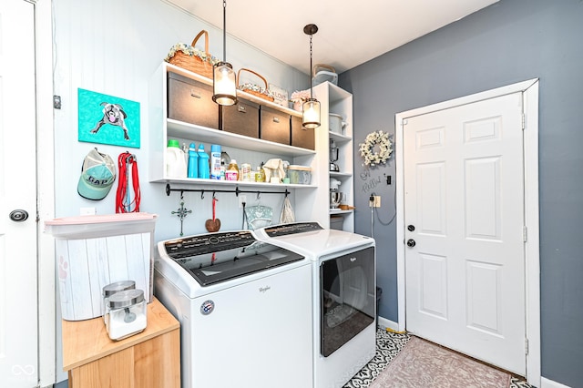 laundry room with laundry area and washer and clothes dryer