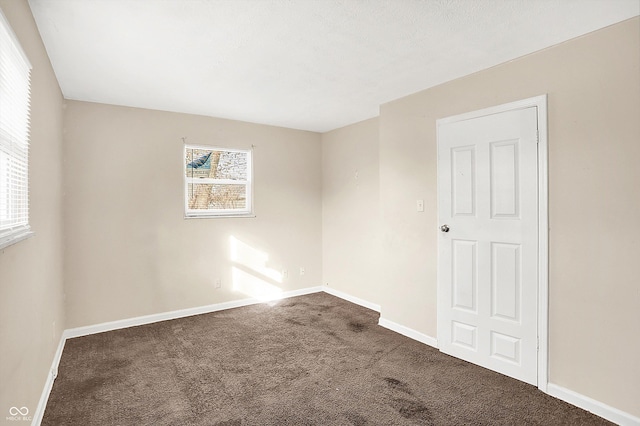 unfurnished room featuring carpet floors