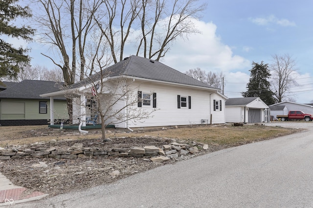 view of home's exterior with an outbuilding and a garage